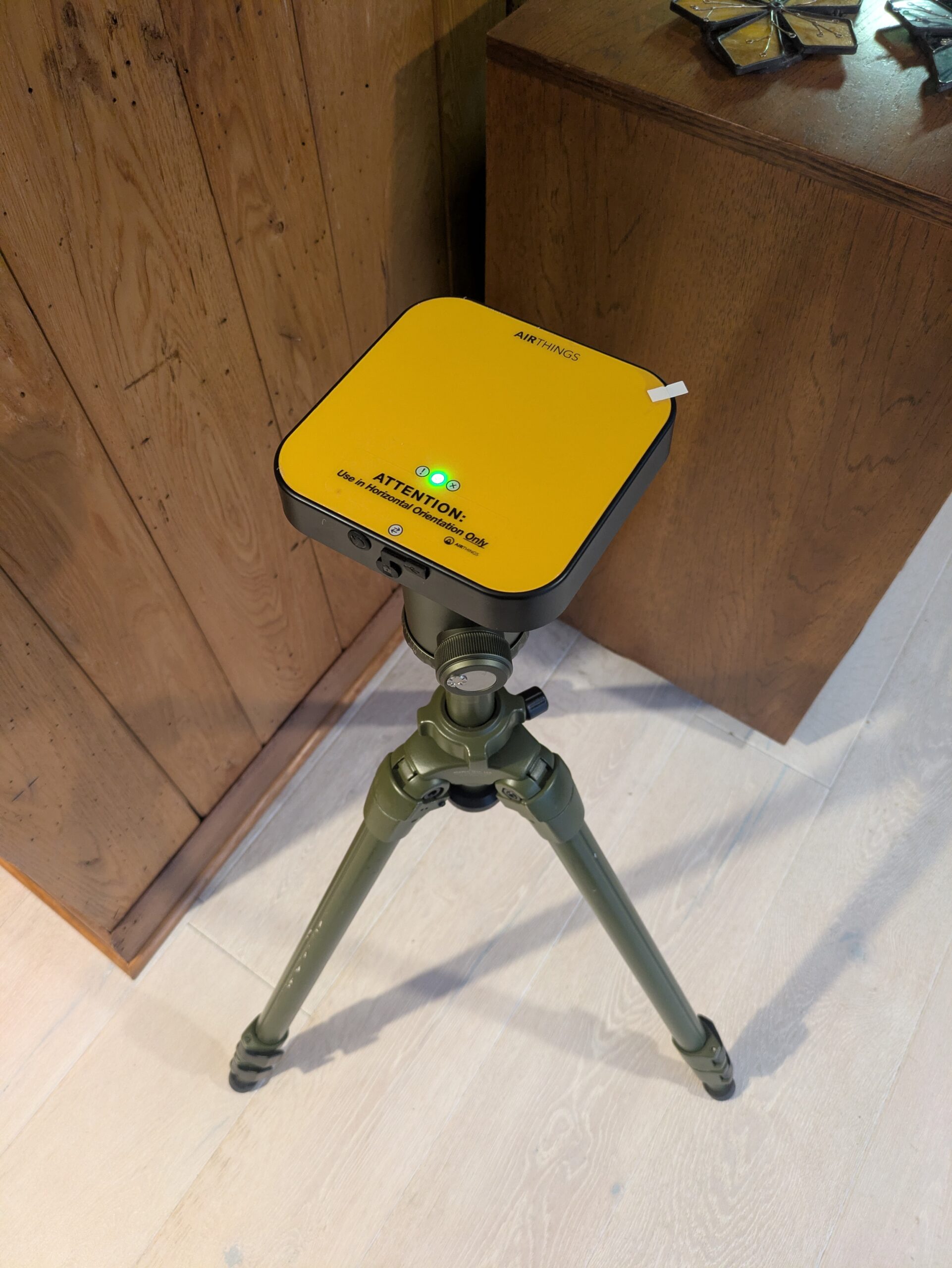 High Country Professional Airthings continuous radon monitor on a tripod used for home inspections in Boone, Blowing Rock, and Banner Elk.